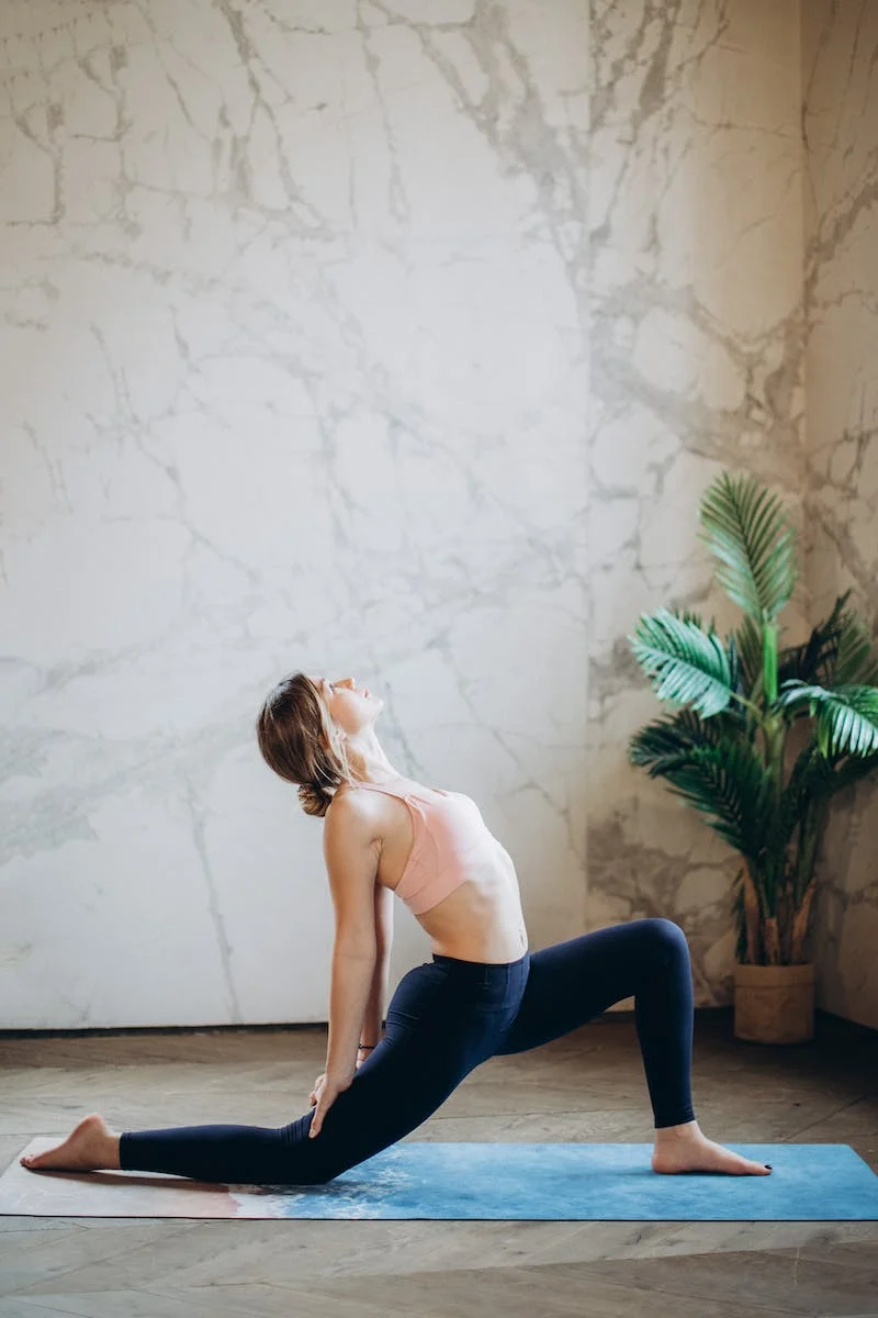 A lady in a yoga pose.