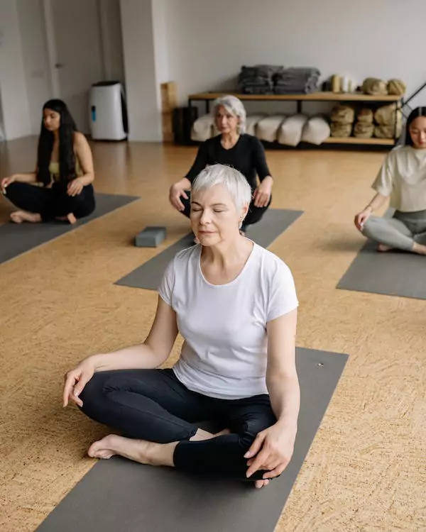 Four ladies meditating together.