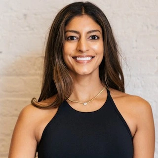 A portrait of smiling lady in black top