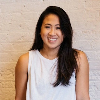 A portrait of a lady in a white t-shirt